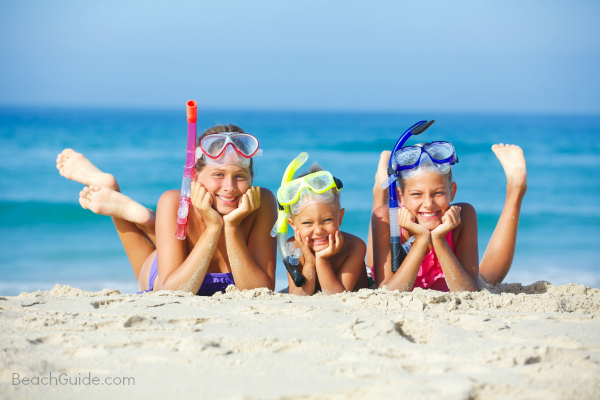 Kids on the beach with snorkel and masks enjoying spring break