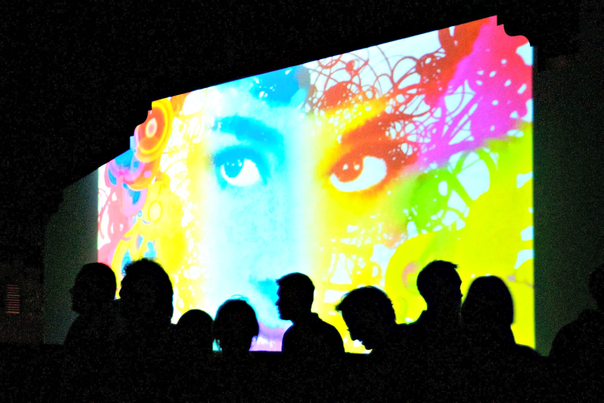 digitally projected woman's face at Digital Graffiti in Alys Beach
