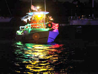 Holiday lights decorate a boat in the Venice Christmas Boat Parade.