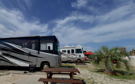 RVs parked near the beach at Pensacola Beach RV Park.