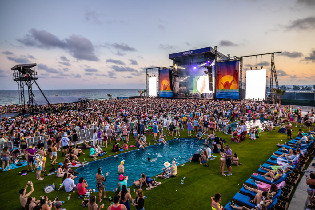 Thousands of music lovers gather in front of one of several Hangout Music Fest stages along the Gulf Coast.
