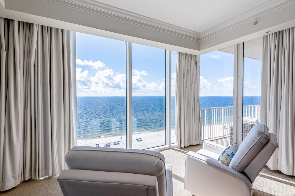 Mediterranean Condo 1002E in Perdido Key's living area with a sweeping view of the beach and Gulf.